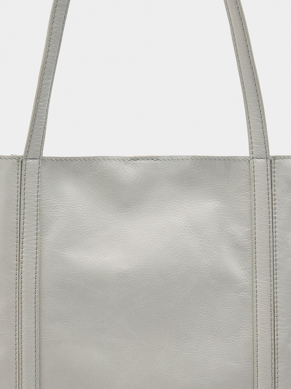 Mala shopper de pele com tachas