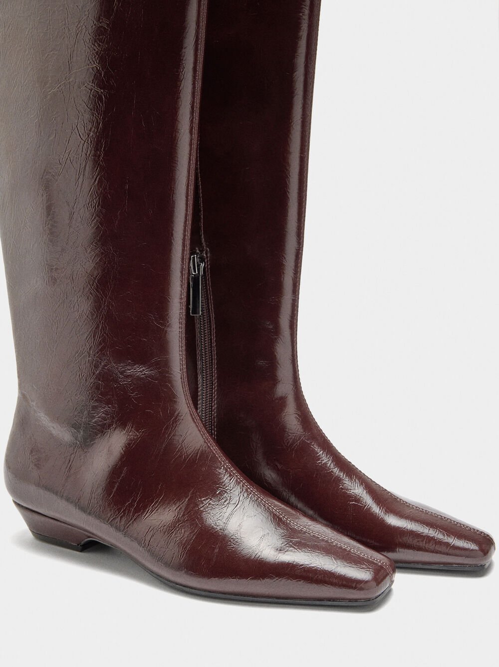 Botas de cano alto envernizadas