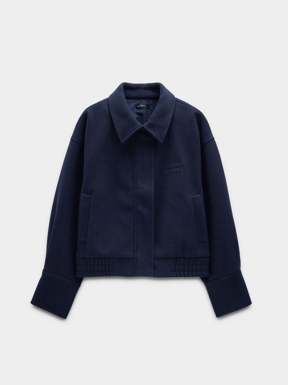 Casaco com bolsos e elástico